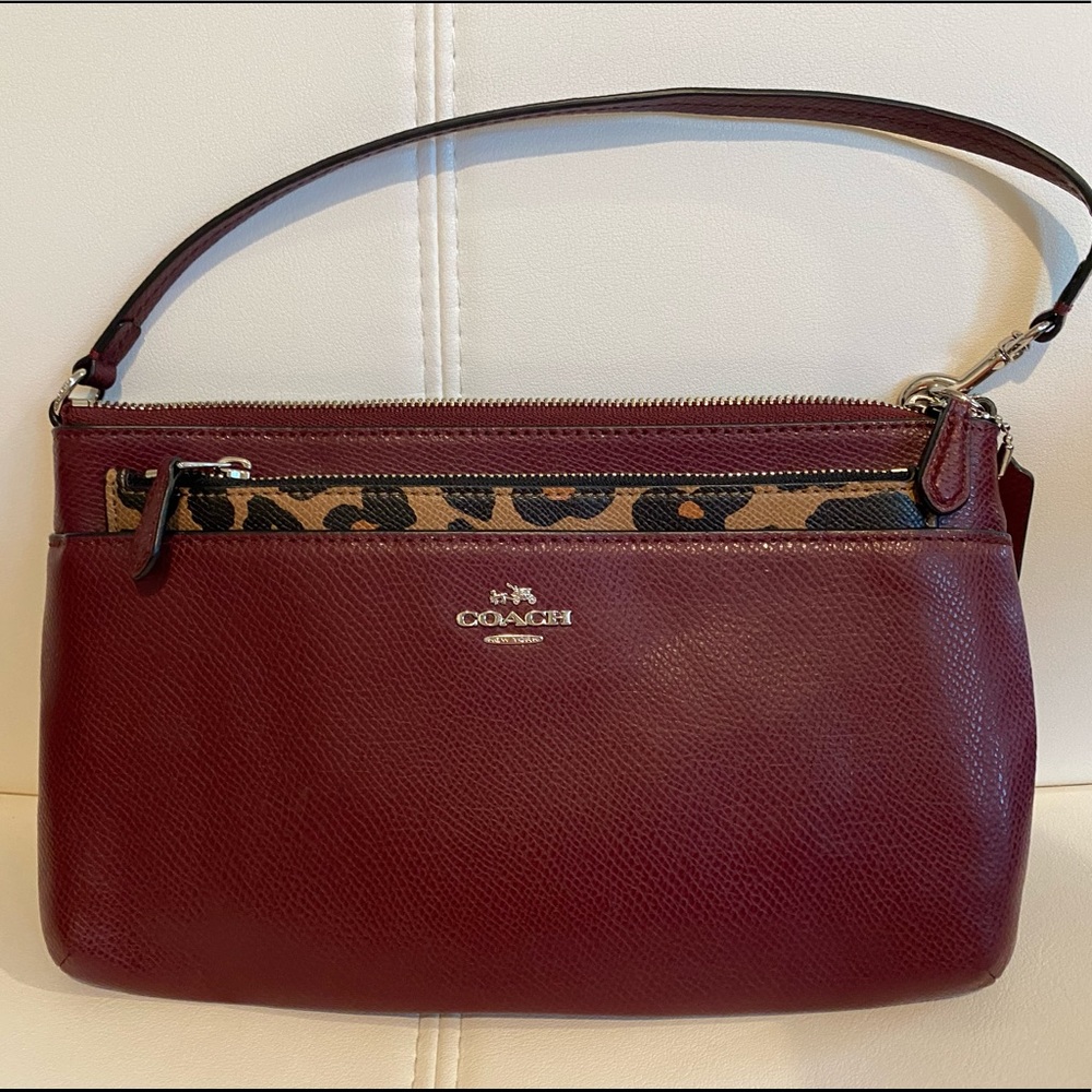 Coach wristlet/clutch with pouch